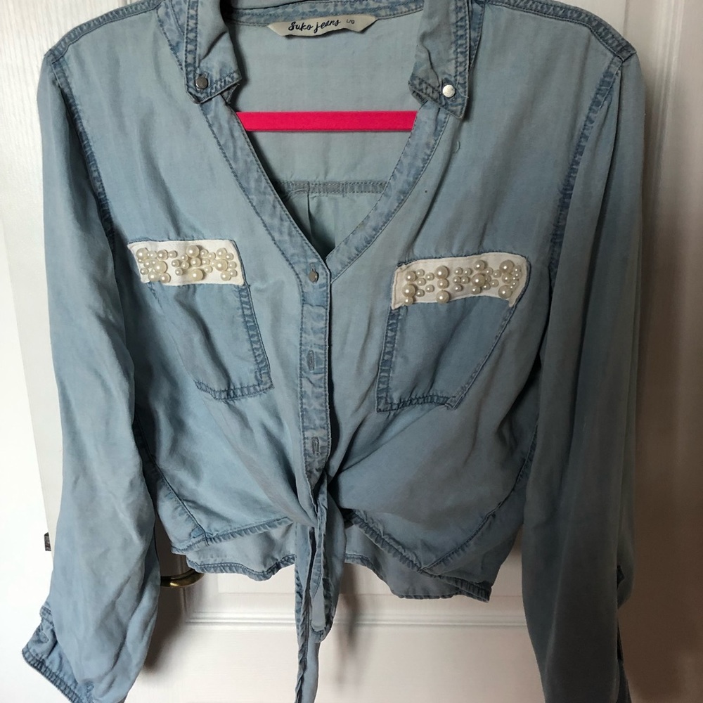 Denim blouse with pearls on top of pockets